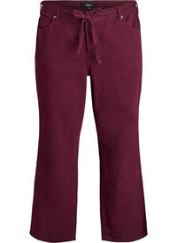 Coloured high-waisted jeans with a tie-belt